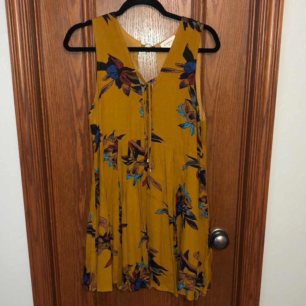 Mustard dress with open hole back with gold accent piece